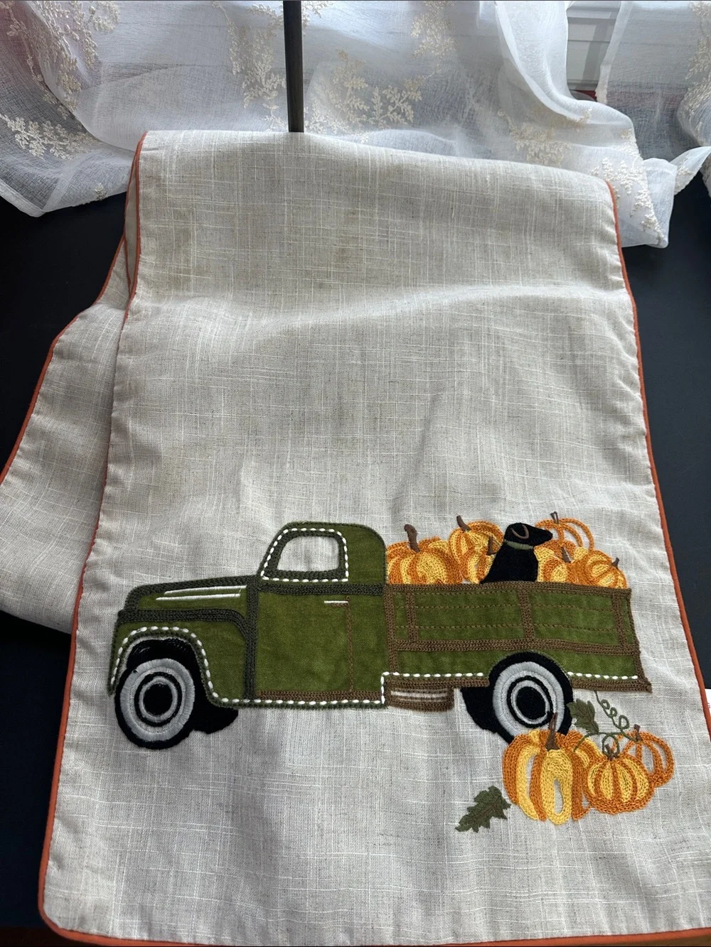 Gilded maple fall table runner with truck and dog pumpkin decor
